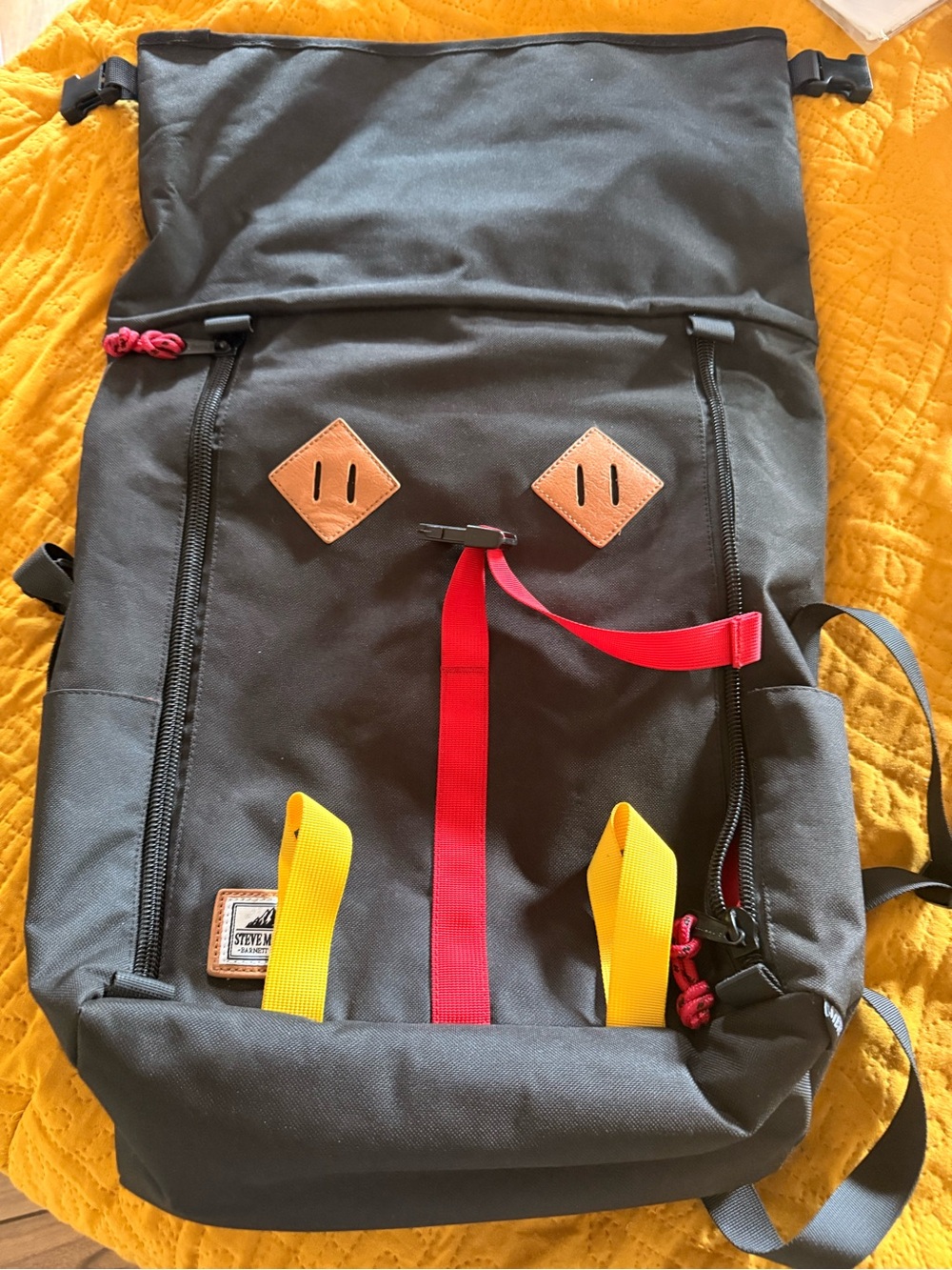 Steve Madden Barnett Avenue Black Backpack with Red and Yellow Accents